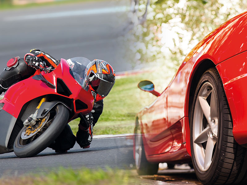 A ducati bike and a Ferrari car